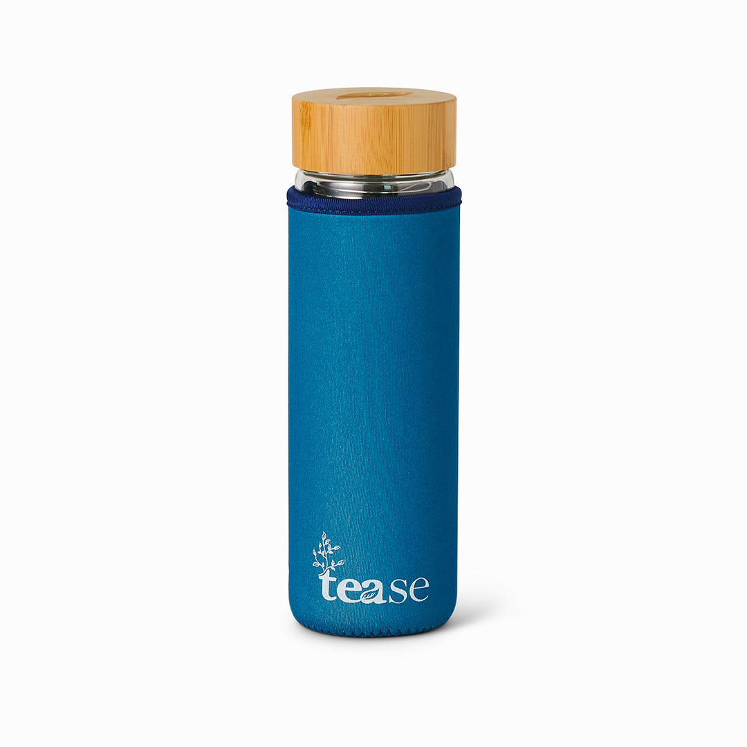 Tease Wellness 3 in 1 Sustainable Glass and Bamboo Tea Tumbler in Bluebell with blue sleeve and bamboo lid.