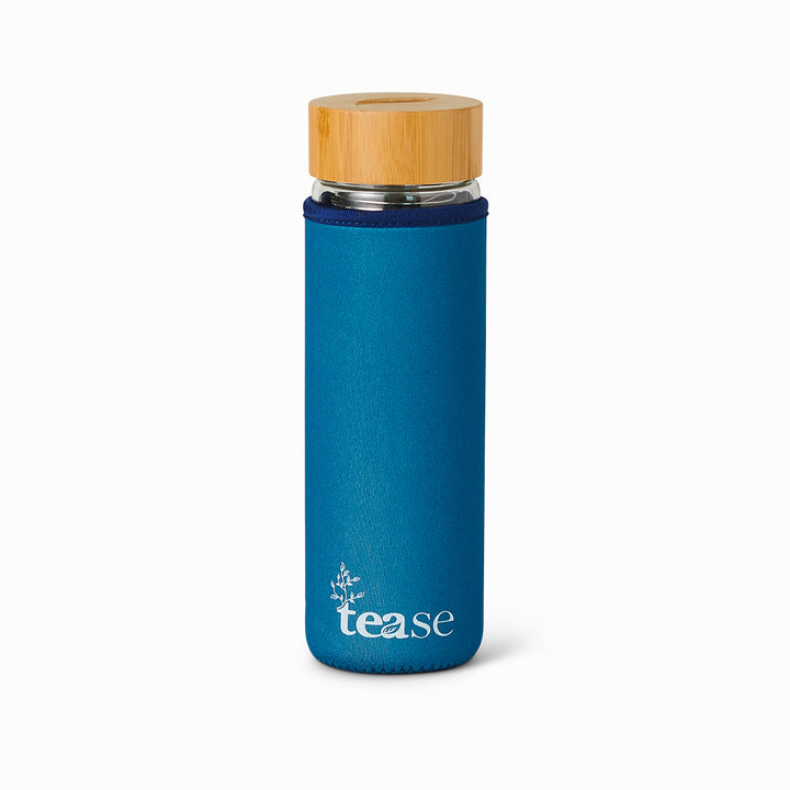 Tease Wellness 3 in 1 Sustainable Glass and Bamboo Tea Tumbler in Bluebell with blue sleeve and bamboo lid.