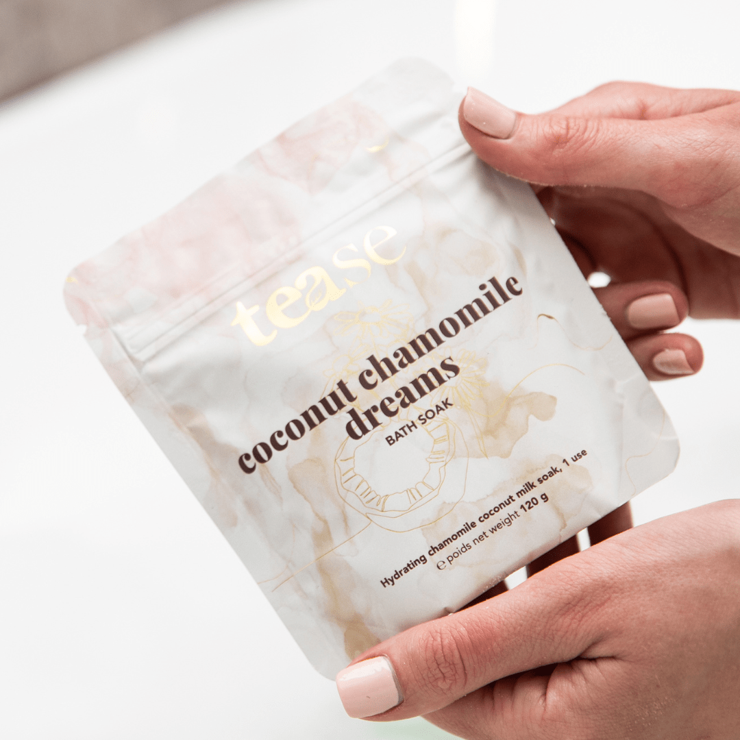 Tease Wellness Coconut Chamomile Dreams Bath Soak in a white resealable pouch with gold and brown text and subtle floral.